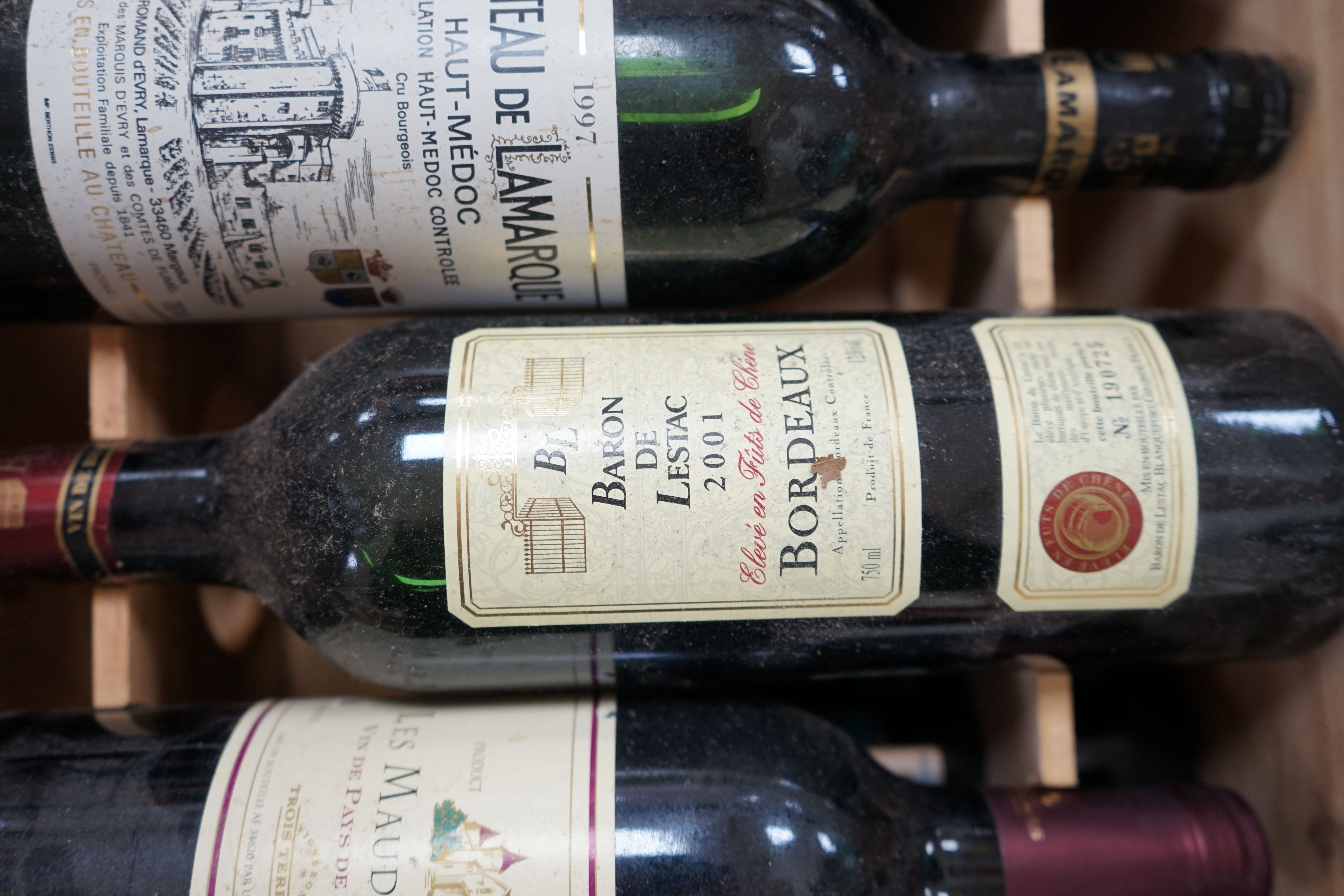 Ten bottles of mixed red wine to include three Château Leoville Barton 1992, in an open crate. Condition - fair to good, storage history unknown.